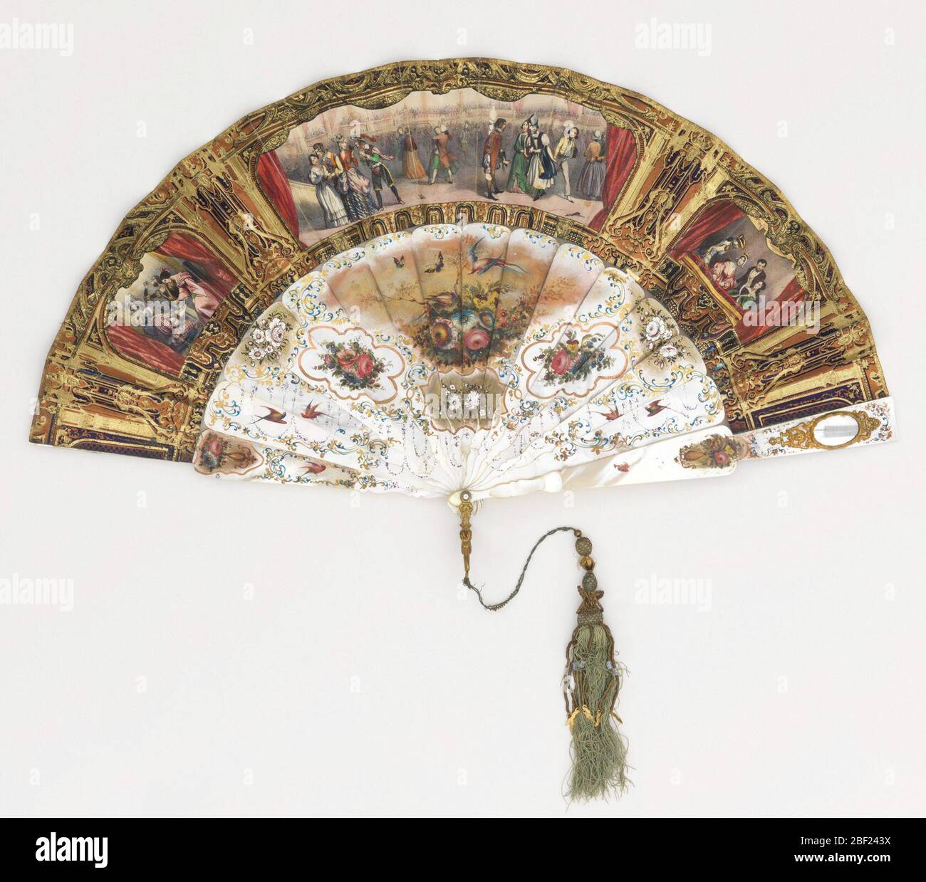 Pleated fan. Pleated fan. Gilded paper leaf with lithographs. Obverse: purple and copper-colored paper gilded showing three proscenium arches with curtains and pseudo-Renaissance motifs framing hand-colored lithographs of theatrical Spanish scenes. Stock Photo