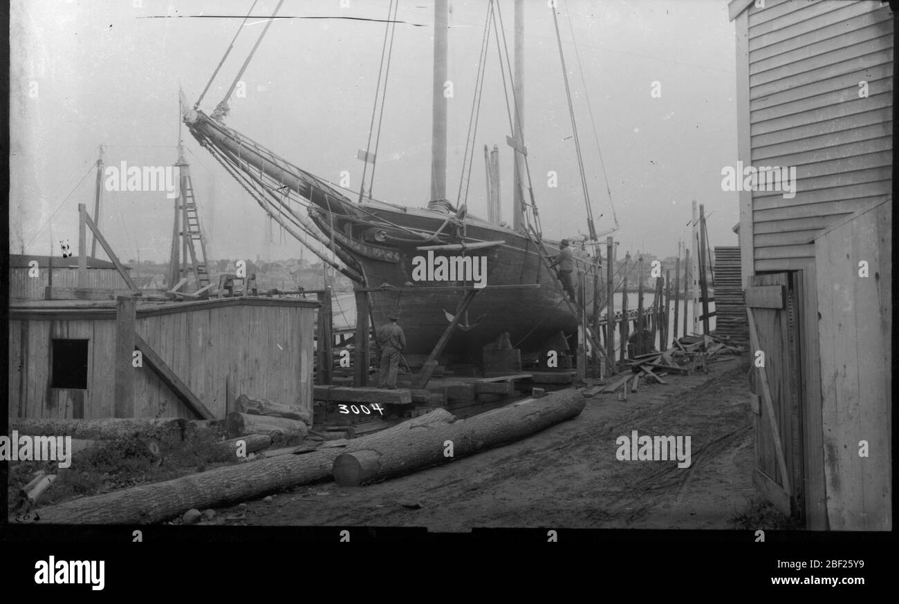 Gloucester Harbor. Description from "United States National Museum, Bulletin 219," page 222.Fishing schooner on marine railway at Rocky Neck, Gloucester, showing the typical headwork of an Essex-built fisherman of the period.Smithsonian Institution Archives, Acc. 11-006, Box 006, Image No. Stock Photo