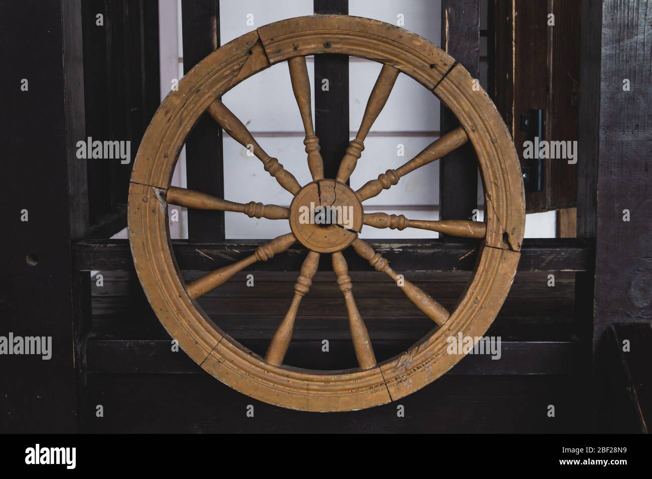 Old wooden wheel of wagon Stock Photo