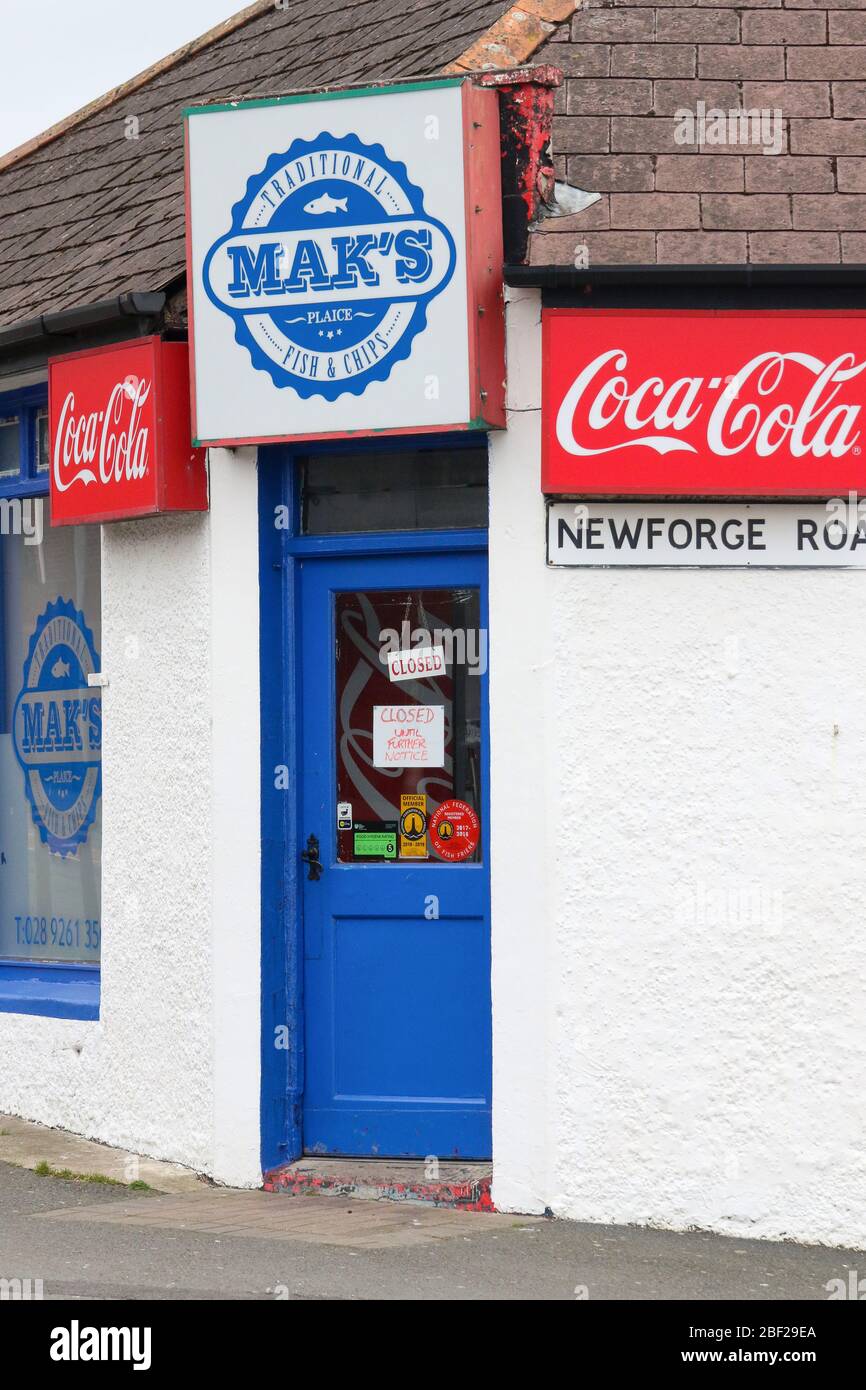 Entrance door to village chip shop in Magheralin with "closed until