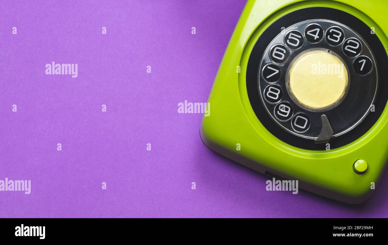 Rotary phone. classic green telephone with round dial. isolated on