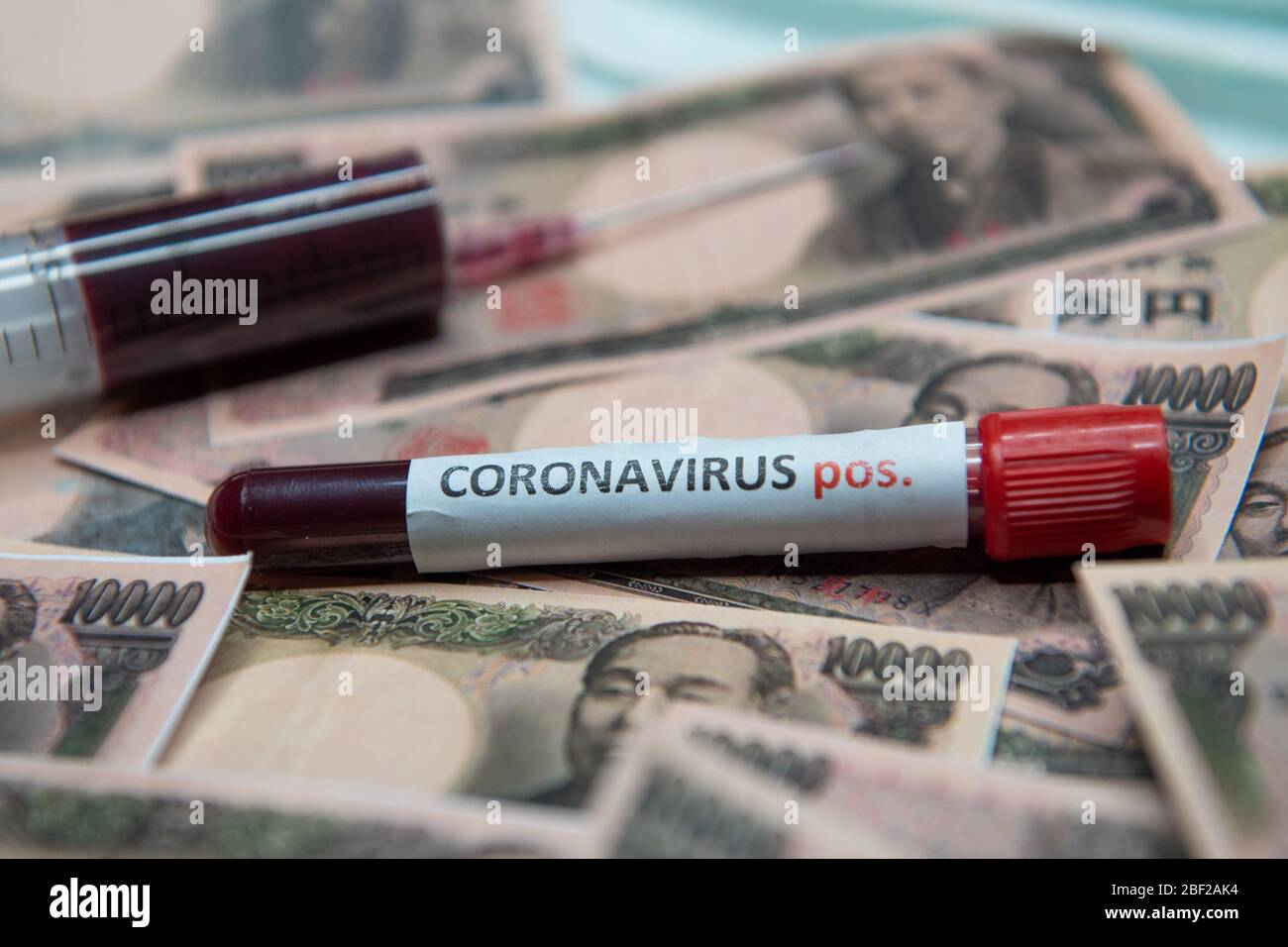 Japanese yen and positive test at coronavirus. Stock Photo