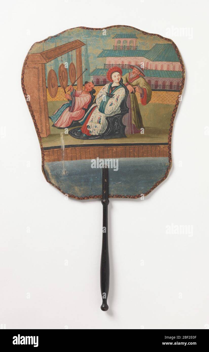 Handscreen. Handscreen with a hand-painted paper leaf. Obverse: a Chinoiserie scene with enthroned woman, Chinese man in hat, and man playing gongs. Reverse: a spray of flowers with three pink blossoms. Turned wood handle. Stock Photo