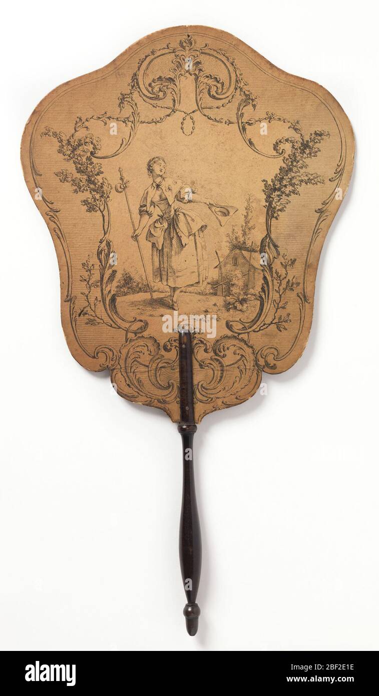 Handscreen. Handscreen with engraved design on paper board. Obverse: a scrolling cartouche with shepherdess doffing a tricorn hat. Reverse: scrolling cartouche with a pile of clothing and possessions in a landscape. Turned wood handle. Stock Photo