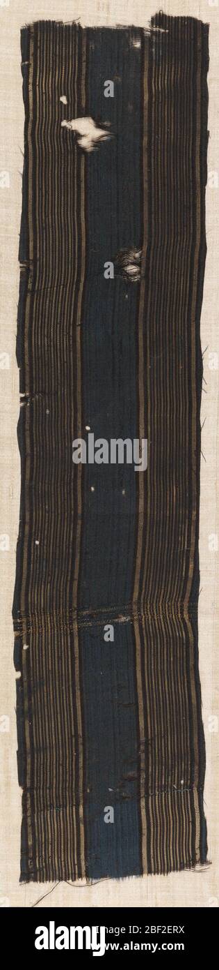 Fragment. Vertical fragment with a wide central band consisting of thin navy blue and black stripes surrounded by borders on either side of thin black and light brown stripes. Stock Photo