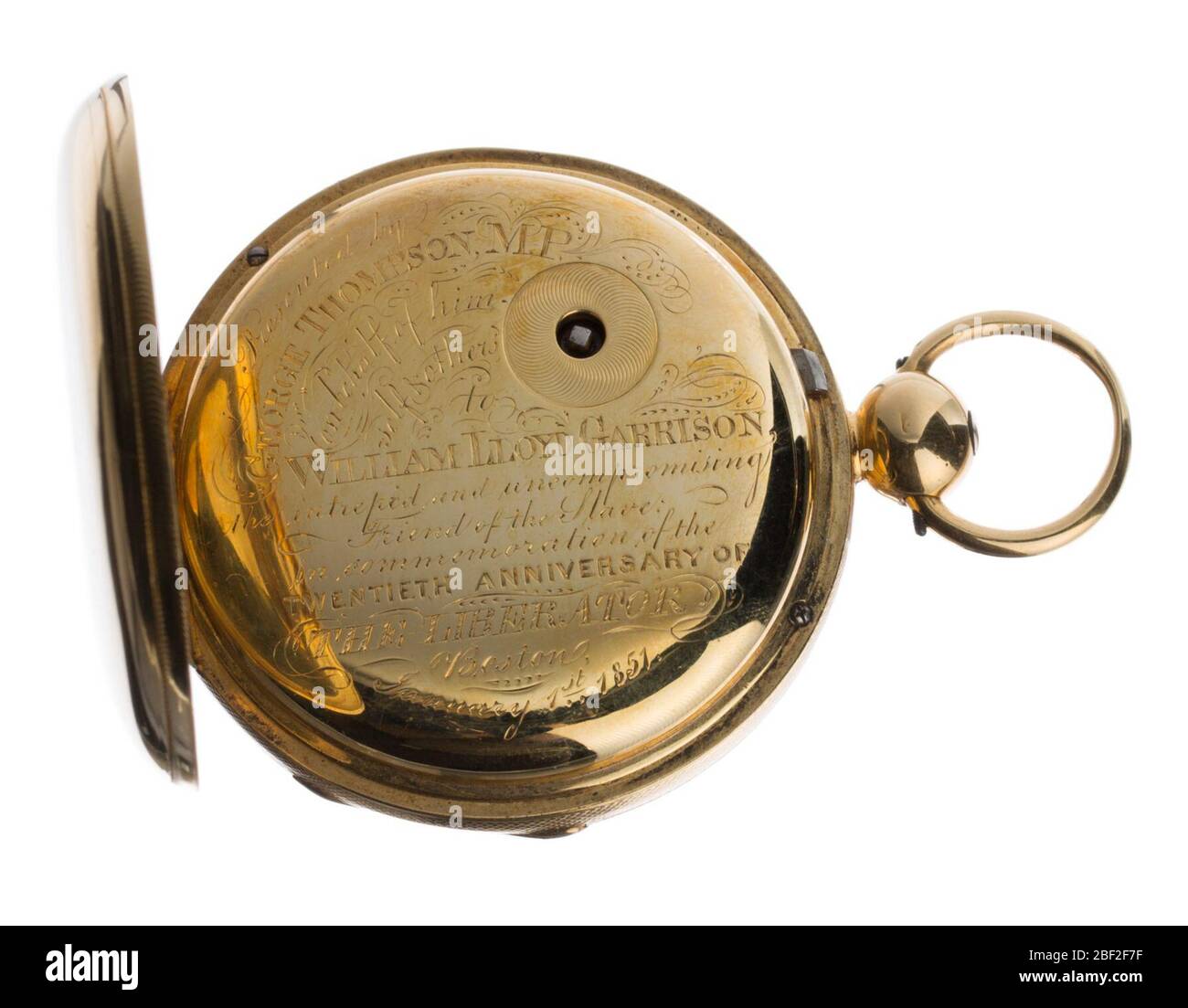 Pocketwatch inscribed to William Lloyd Garrison from George Thompson. An inscribed gold pocket watch presented to William Lloyd Garrison. The watch has a half hunter case, with spring hinged glass cover over the dial and a hinged gold lid over the back, protecting the inscription and winding square. Stock Photo