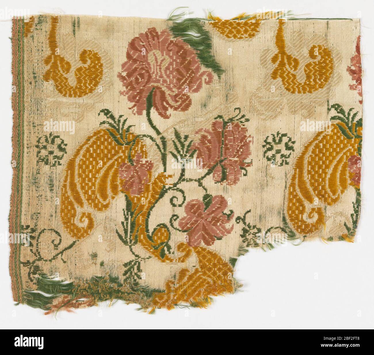 Fragment. White satin ground with design of floral sprays repeated in horizontal rows. Green and white continuous supplementary wefts form part of the design, with yellow and rose brocading. Stock Photo