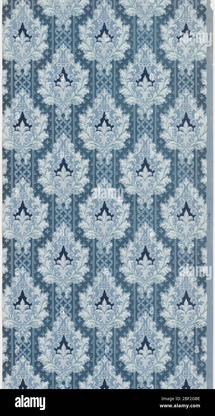 Sidewall. Design of closely spaced foliate medallions. Printed in shades of blue on striped blue background. Stock Photo