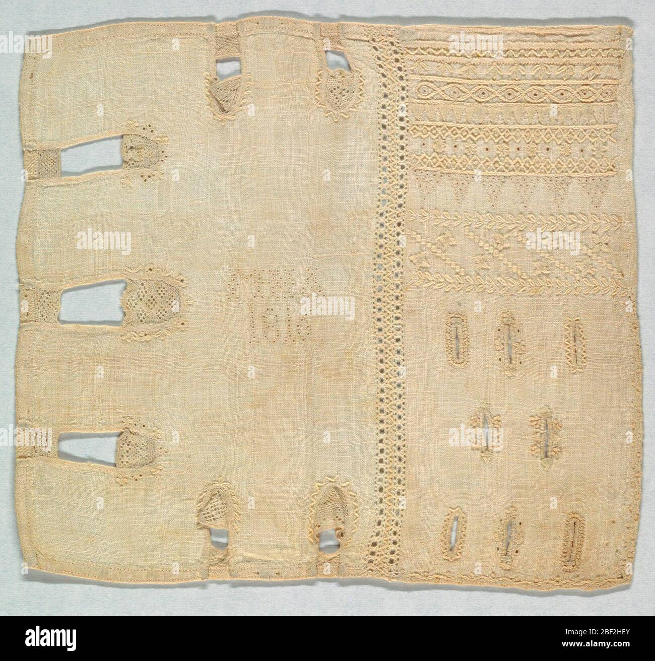 Sampler. Whitework sampler with seven plackets and eight button holes ...