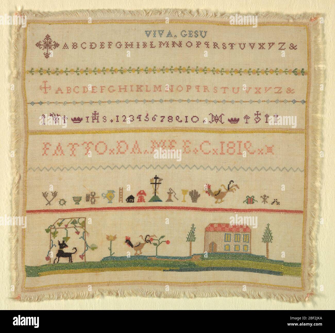 Sampler. Bands of two alphabets introduced by Maltese crosses, signature, symbols of the passion and landscape. Stock Photo