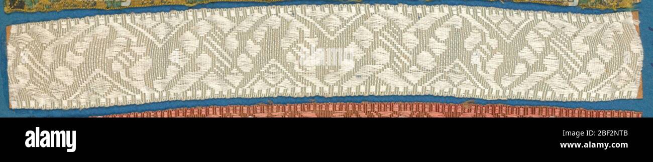 Trimming. White trimming fragment in a design of an ornamented zigzag band. Stock Photo