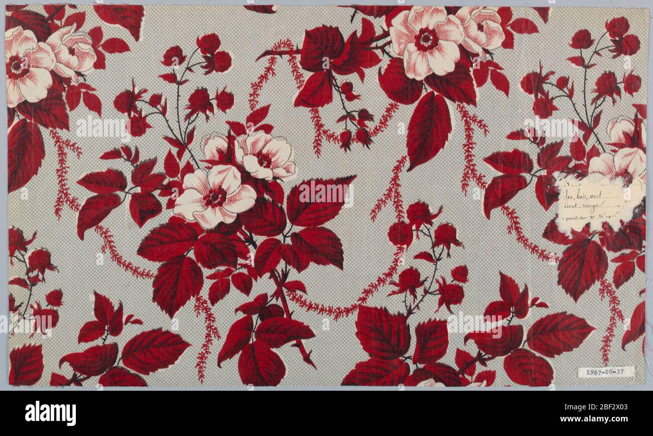 Textile. Ground printed in grey, by molette, in minute all-over disapered pattern; clusters of white moss roses, red raspberries and foliage connected by slender meandering vine, are printed over the molette ground. Stock Photo