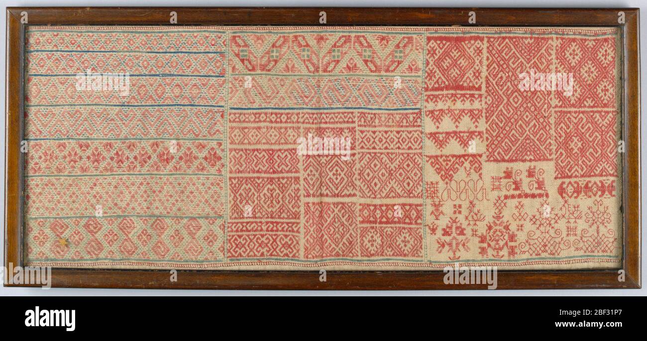 Sampler. Geometric bands and borders in red and blue counted thread ...