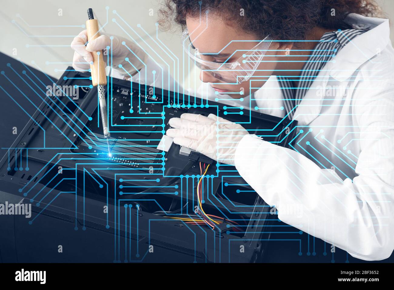 Electronic technician working in service center Stock Photo