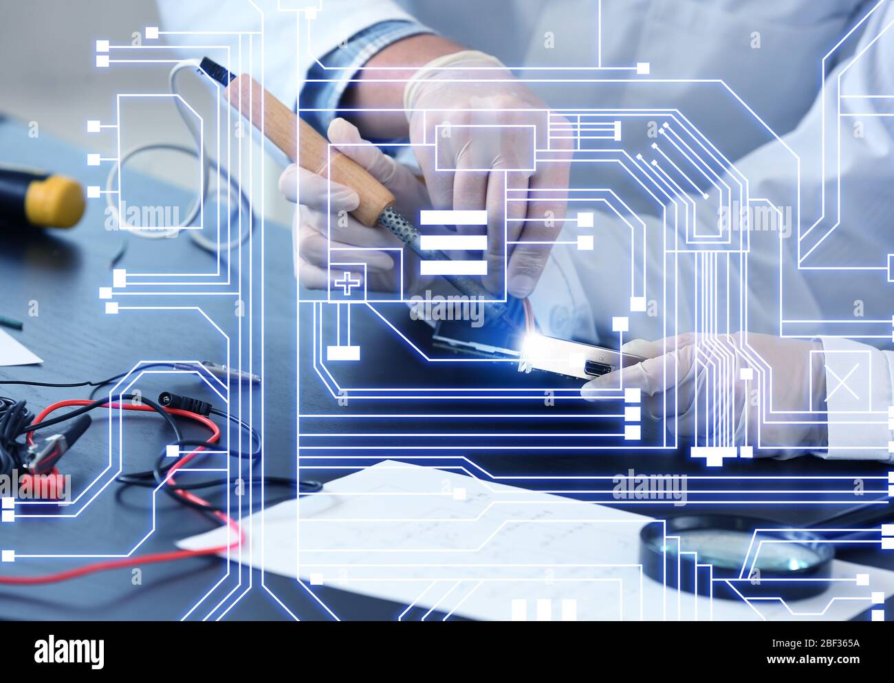 Electronic technicians working in service center Stock Photo