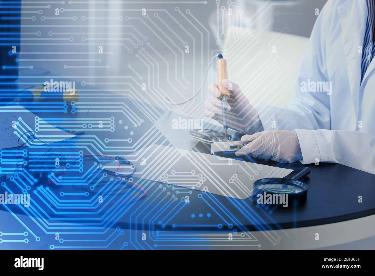 Electronic technician working in service center Stock Photo