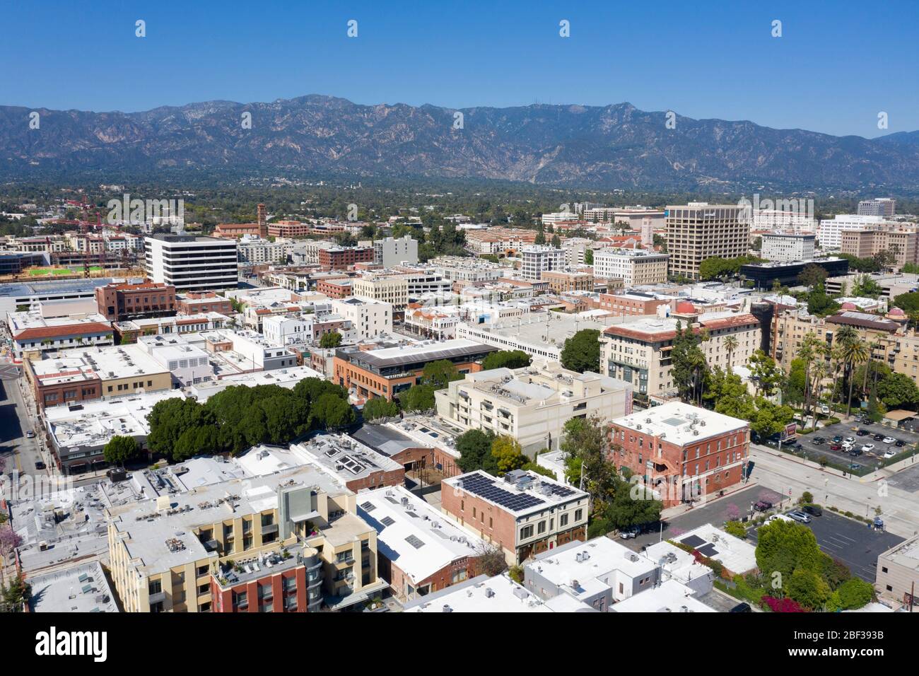 Aerial views above downtown Pasadena, California on a clear day with the San Gabriel Mountains in the distance Stock Photo