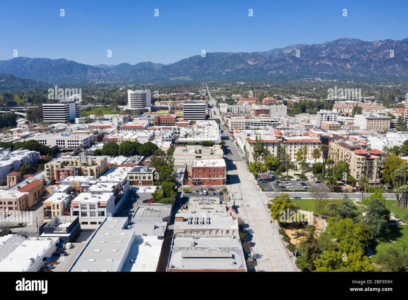 Aerial views above downtown Pasadena, California on a clear day with the San Gabriel Mountains in the distance Stock Photo