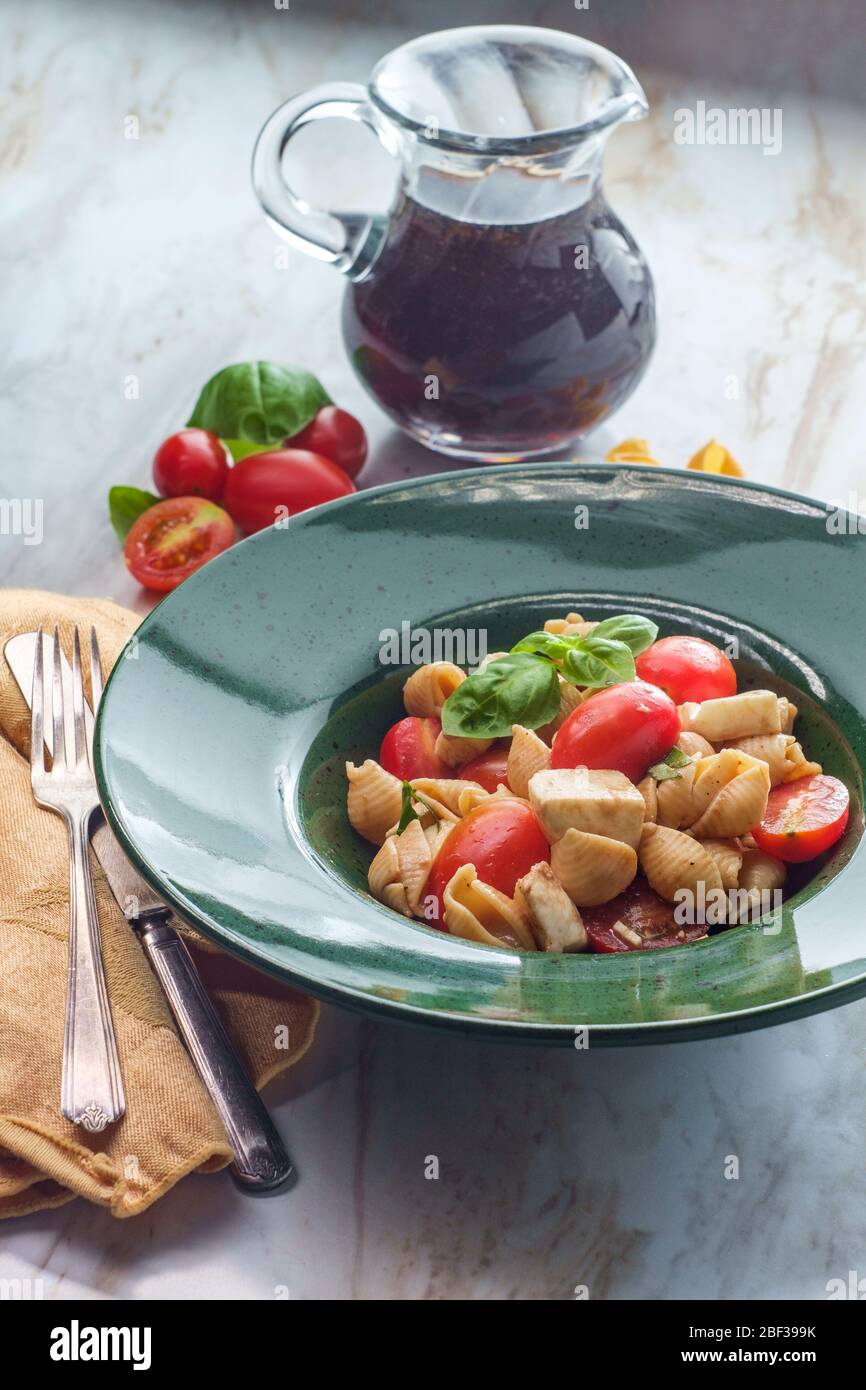 Fresh caprese pasta salad with extra virgin olive oil balsamic vinegar