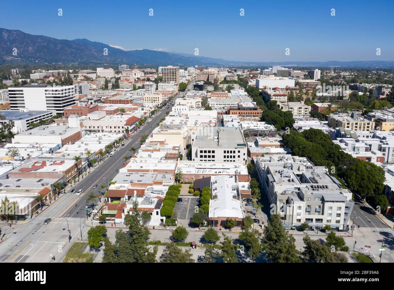 Aerial views above downtown Pasadena, California on a clear day with the San Gabriel Mountains in the distance Stock Photo
