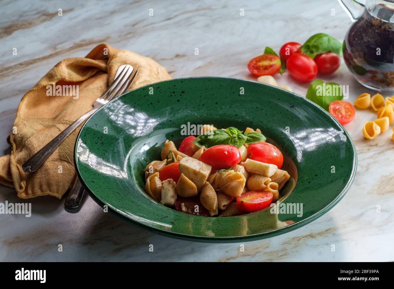 Fresh caprese pasta salad with extra virgin olive oil balsamic vinegar