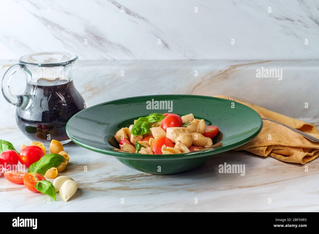 Fresh caprese pasta salad with extra virgin olive oil balsamic vinegar
