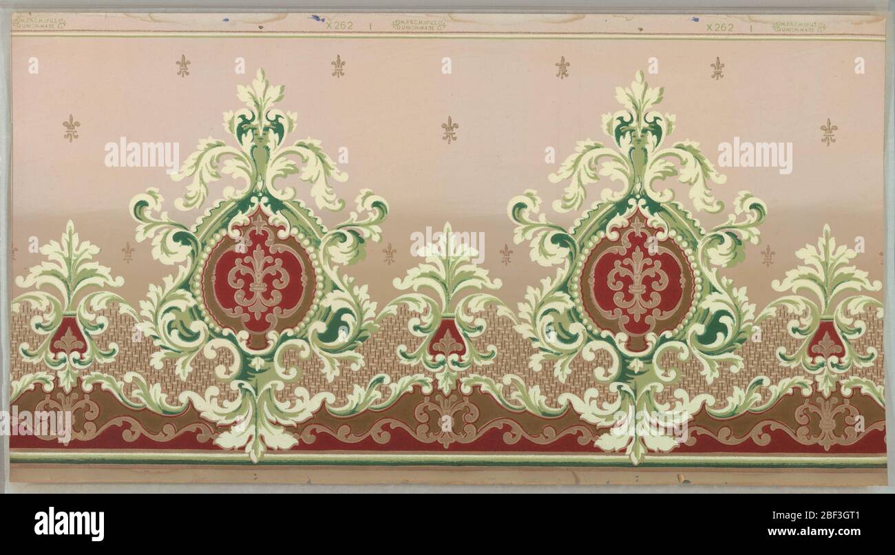 Frieze. Large-scale foliate medallions, each containing a fleur-de-lis. Pritned in tan, green and off-white on a background that is light tan on top half and darker tan on bottom half. Stock Photo