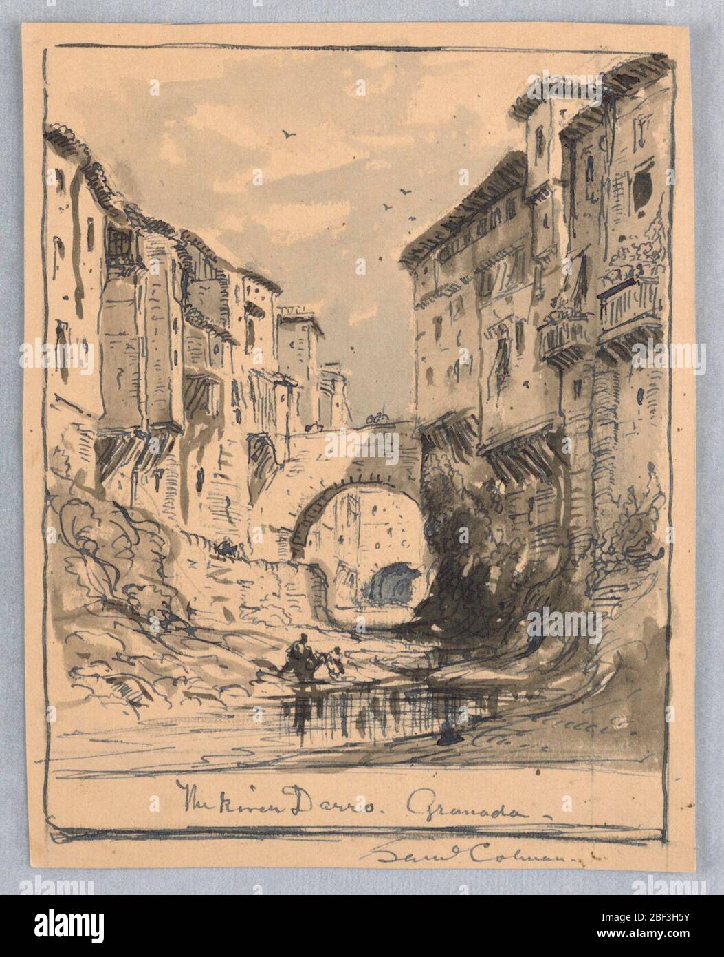 The River Darro Granada. Verticle rectangle. Water and two figures in foreground. Backs of houses and porches on both sides of the stream. A bridge over the water and other bridges beyond. Stock Photo