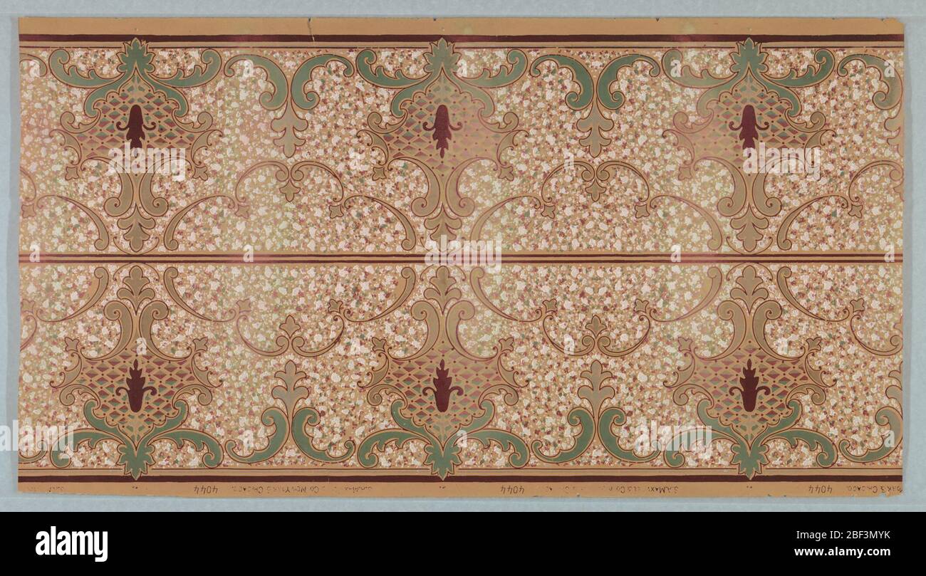 Frieze. Scrolls and floral motifs on background of all-over mottled effect. Recommended for kitchens and children's rooms as the surface design hid fingermarks and dirt. Borders printed two across the width. Stock Photo