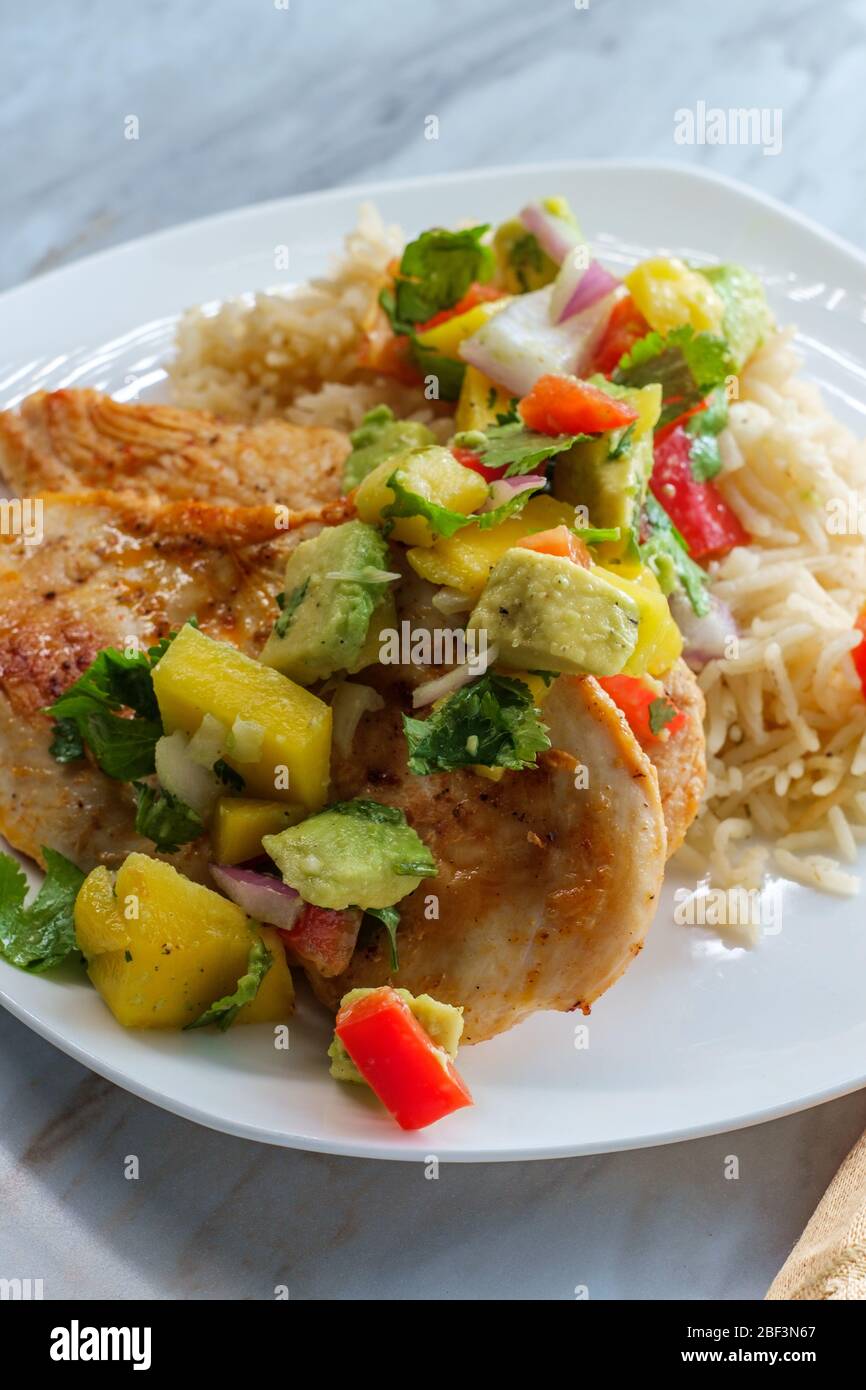 Gluten Free Mexican Grilled Chicken With Mango And Avocado Salsa Stock Photo Alamy