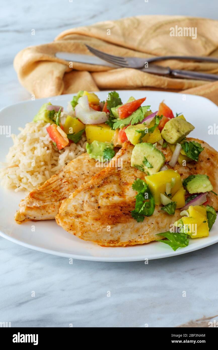 Gluten Free Mexican Grilled Chicken With Mango And Avocado Salsa Stock Photo Alamy