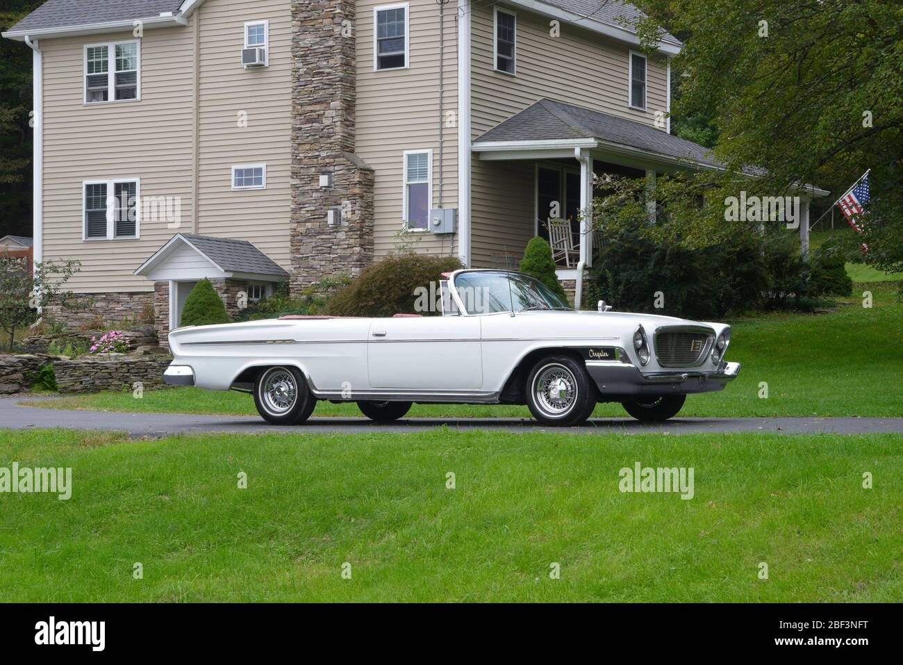 White 1962 Chrysler Newport convertible with top down, facing right, in  country driveway Stock Photo - Alamy, image size:1300x957