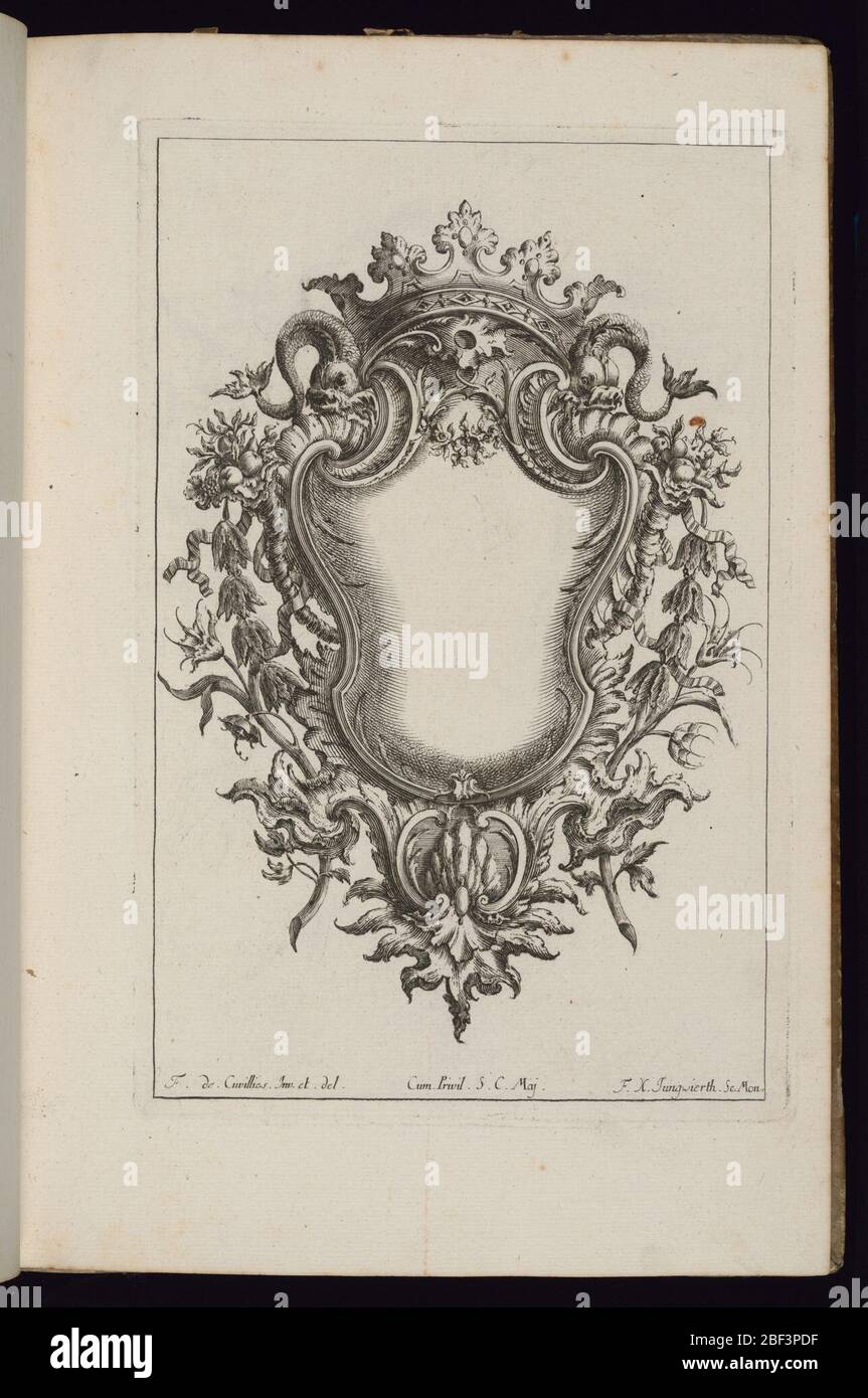 Cartouche with Crown and Dolphins Livre de Cartouches Reguliers Book of Regular Cartouches. Blank symmetrical cartouche in Rococo style framed with a large crown and two dolphins at top. Bordering vegetal decoration. Stock Photo