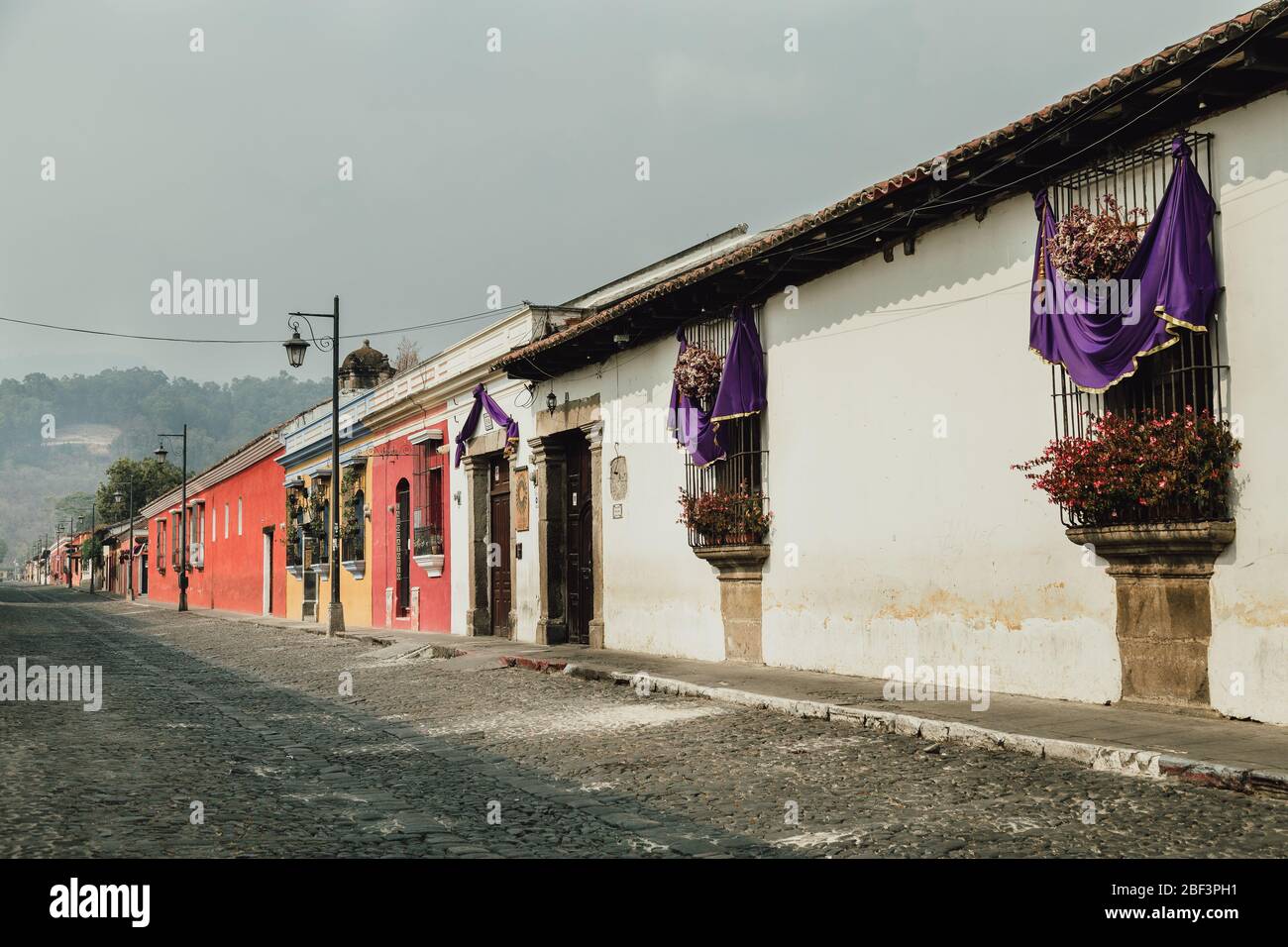 empty streets during coronavirus pandemic, traditional Easter Semana Santa decorations in the windows in Antigua Guatemala Stock Photo