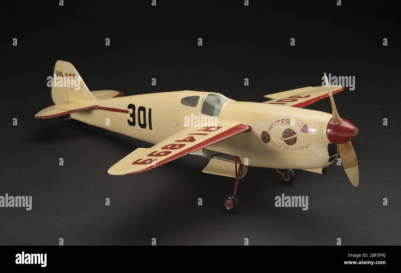 Model Static Folkerts Speed King SK3 Jupiter Pride of Lemont. Balsa wood, metal, and clear acetate display model of the Folkerts Speed King SK-3 'Jupiter - Pride of Lemont' mid-wing racing monoplane which won the 1937 Thompson Trophy race in an overall cream and red color scheme. 1/16 Scale. Circa 1942. Stock Photo