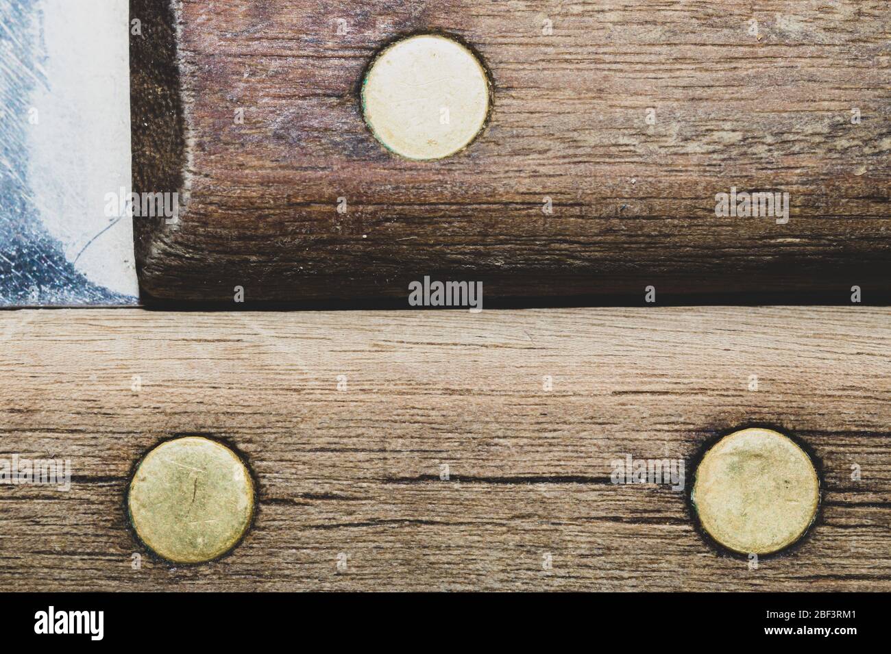 Old wooden background with dowels. wood texture with a metal pins Stock Photo
