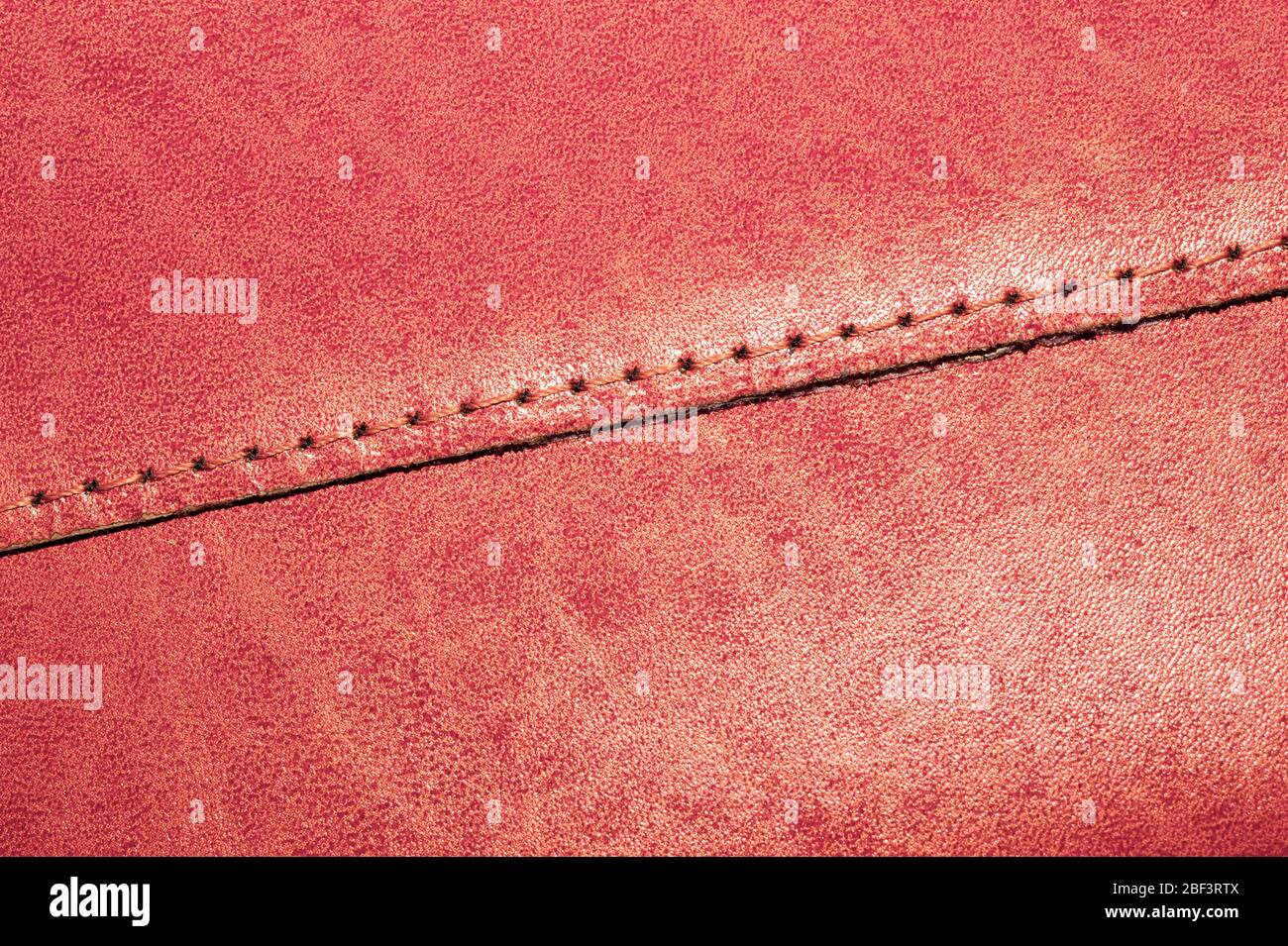 Brown leather texture with a linear stitch. material with seam Stock Photo