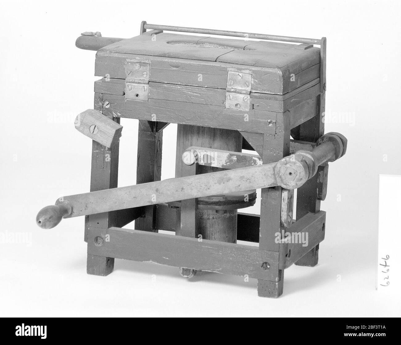 Patent Model of a Printing Press for Uneven Surfaces. This patent model demonstrates an invention for a printing press for uneven surfaces which was granted patent number 62646. The patent describes relief printing from a vulcanized rubber plate with fluid pressure, such as air pressure. Stock Photo