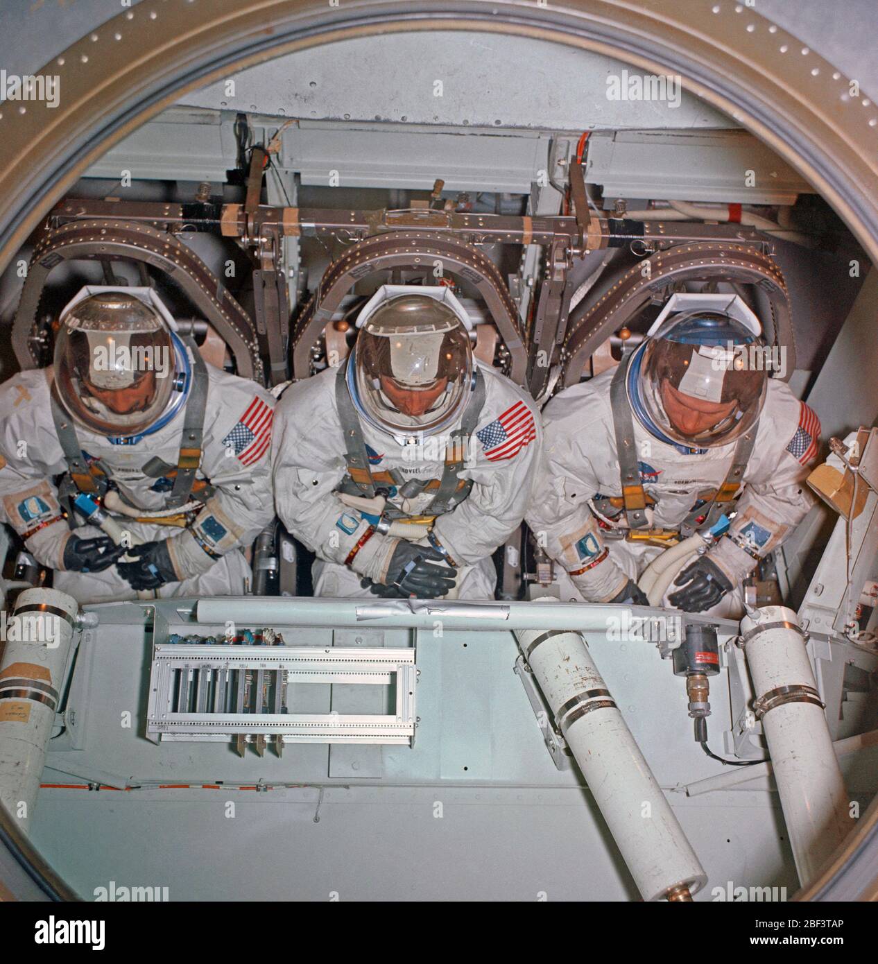 (1 Nov. 1968) --- The Apollo 8 prime crew inside the centrifuge gondola in Building 29 during centrifuge training in MSC's Flight Acceleration Facility. (View with crew lying on back) Left to right are astronauts William A. Anders, lunar module pilot; James A. Lovell Jr., command module pilot; and Frank Borman, commander. Stock Photo