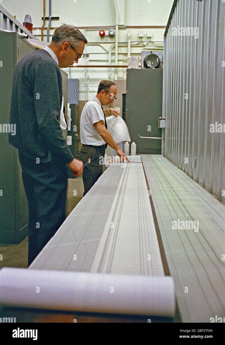 N221 40x80ft wind tunnel control room engineers read data printout