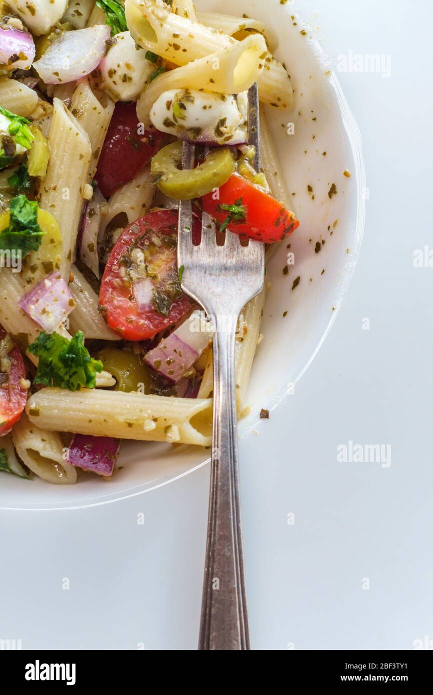 Gluten free Italian pesto pasta salad with pearl mozzarella cheese