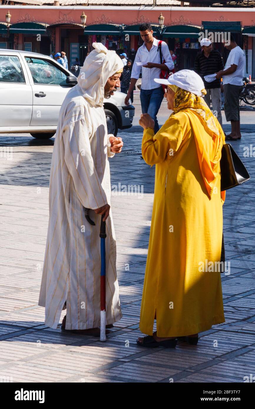 Marrakesh, Morocco - September 8th 2010: Two Moroccans in conversation with each other. Long gowns are commonly worn. Stock Photo