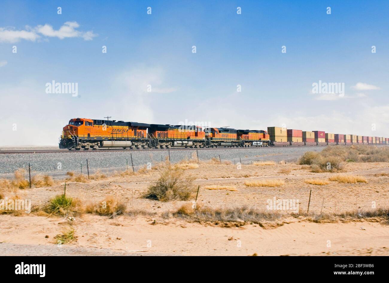 2006 Multiple BNSF freight train engines haul cars of shipping