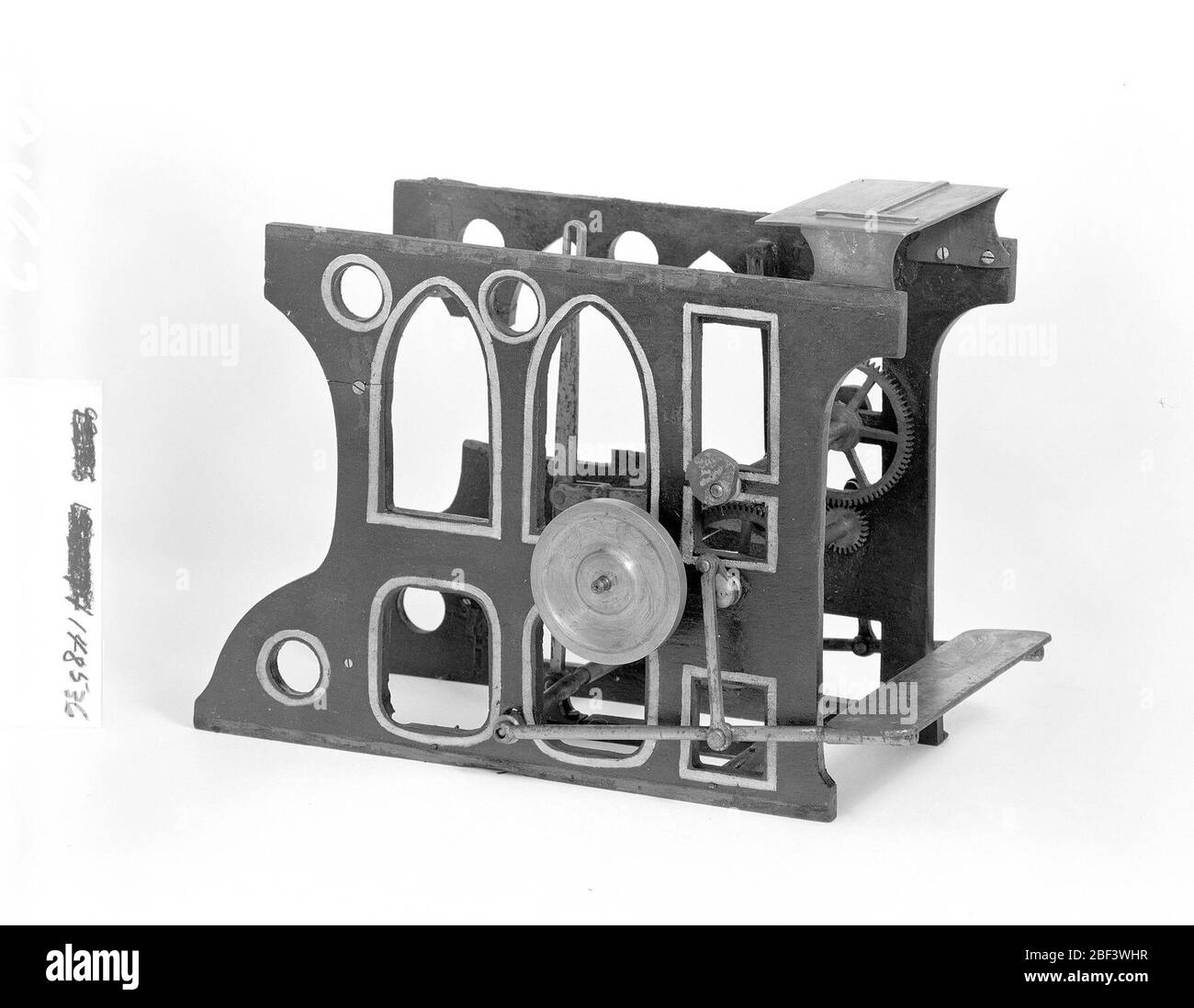 Patent Model for a Lithographic Printing Press. This patent model demonstrates an invention for a lithographic printing press which was granted patent number 148530. The patent describes a self-inking, self-dampening, flatbed cylinder press. Patentee Charles Waddie was from Edinburgh, Scotland.Currently not on view Stock Photo