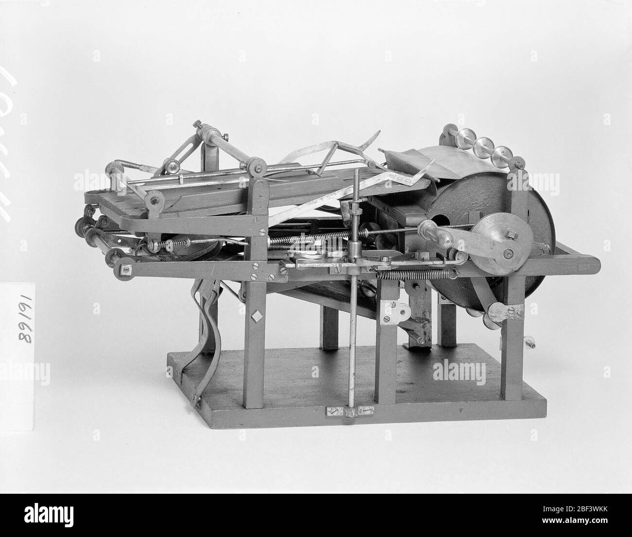 Patent Model for a SheetFeed Apparatus. This patent model demonstrates an invention for a sheet-feed apparatus which was granted patent number 16168. The patent covered both the paper feeder to handle folded sheets, and the folding apparatus.Currently not on view Stock Photo