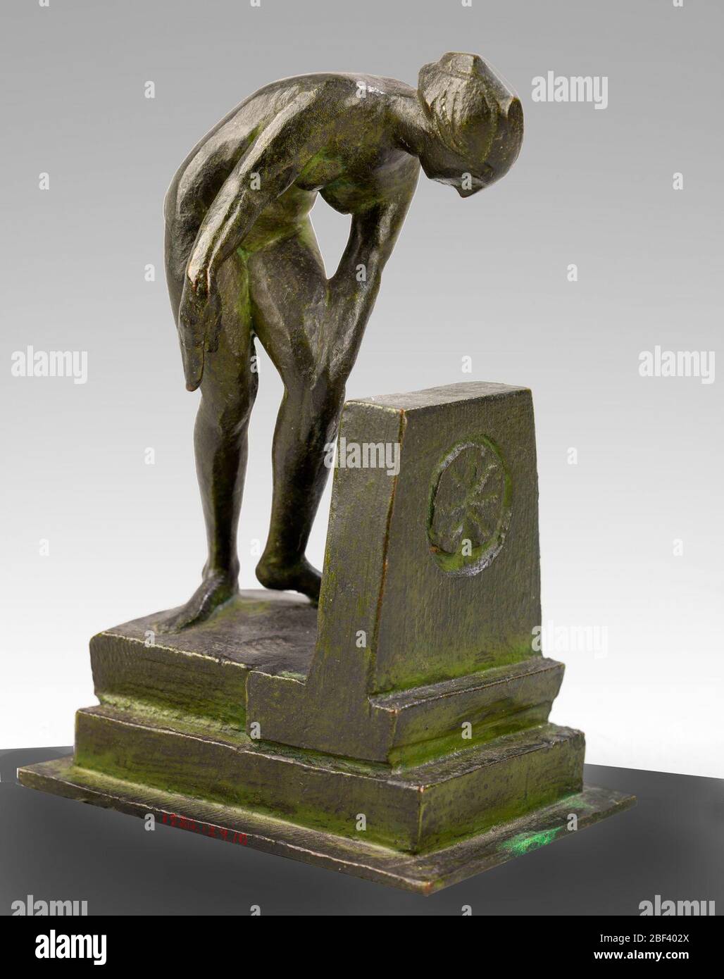 Sculpture of a Bather. Although Arthur Davies was primarily a painter, he experimented with different media, including lithography, textiles, and sculpture. After the influential 1913 Armory Show, Davies began carving a series of figures out of cedar blocks. Stock Photo