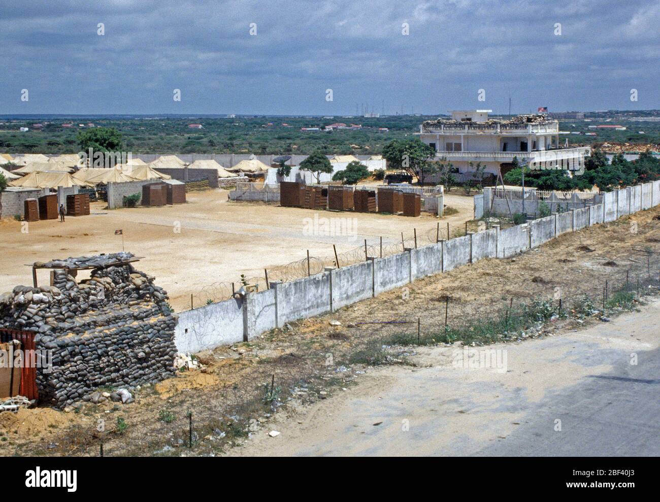 MOGADISHU, SOMALIA... 30 Oct 1993... Operation Continue Hope.  A view of Hunter Base, home for the 561st Signal Battalion, 40th Transportation Company and 196th Quartermaster Company.  Sandbags have been placed on top of a CONEX to reinforce a break in the wall. Stock Photo