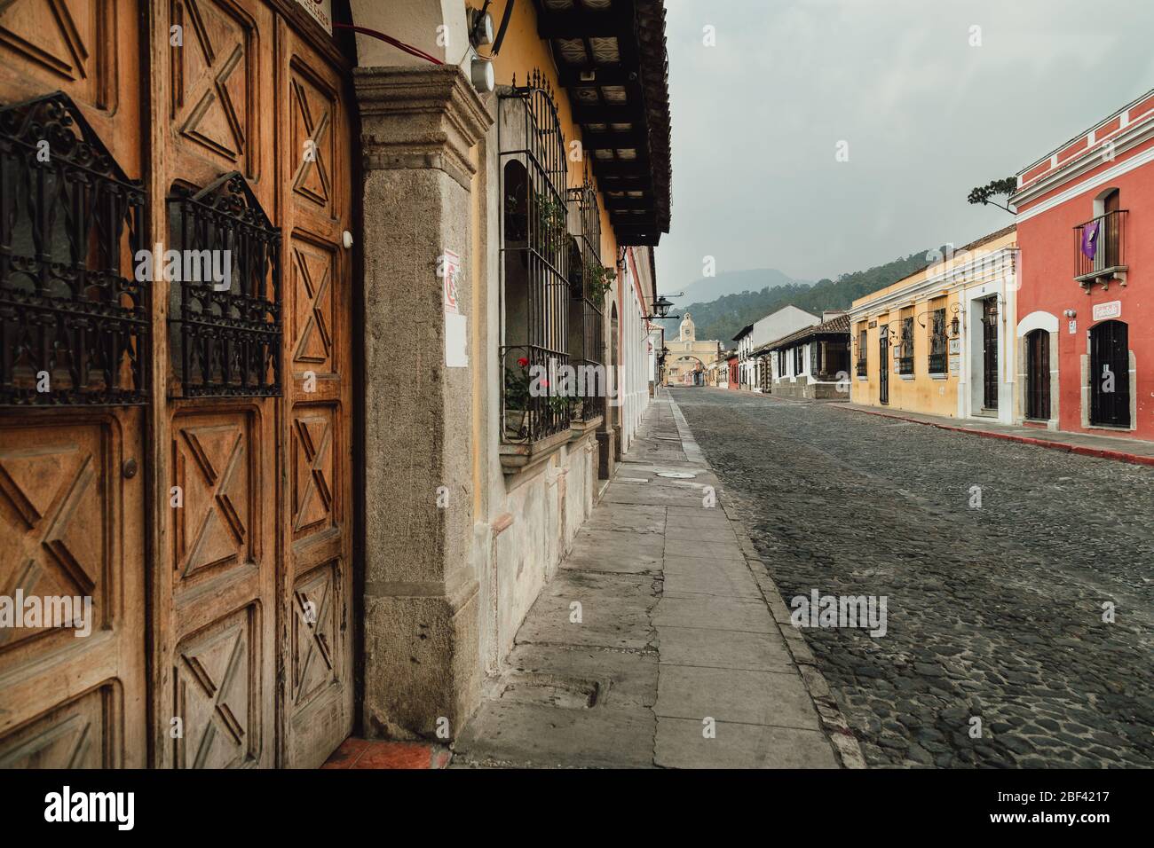 Empty streets as curfew begins in colonial Antigua Guatemala, a popular tourist destination, businesses closed due to coronavirus pandemic quarantine Stock Photo