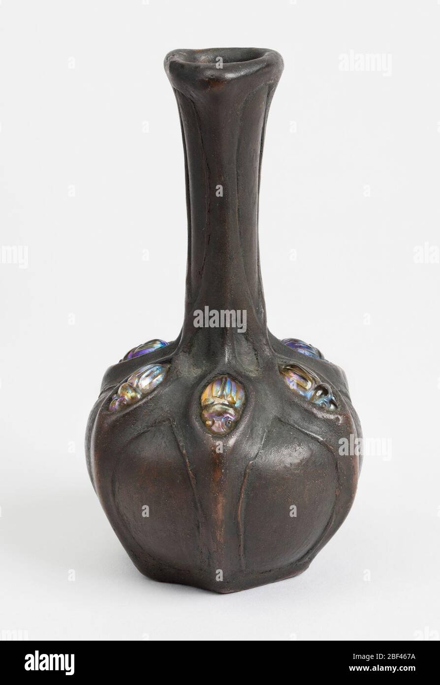 Vase. Bronzeplated vase with six inlaid scarabs. White clay body, semi