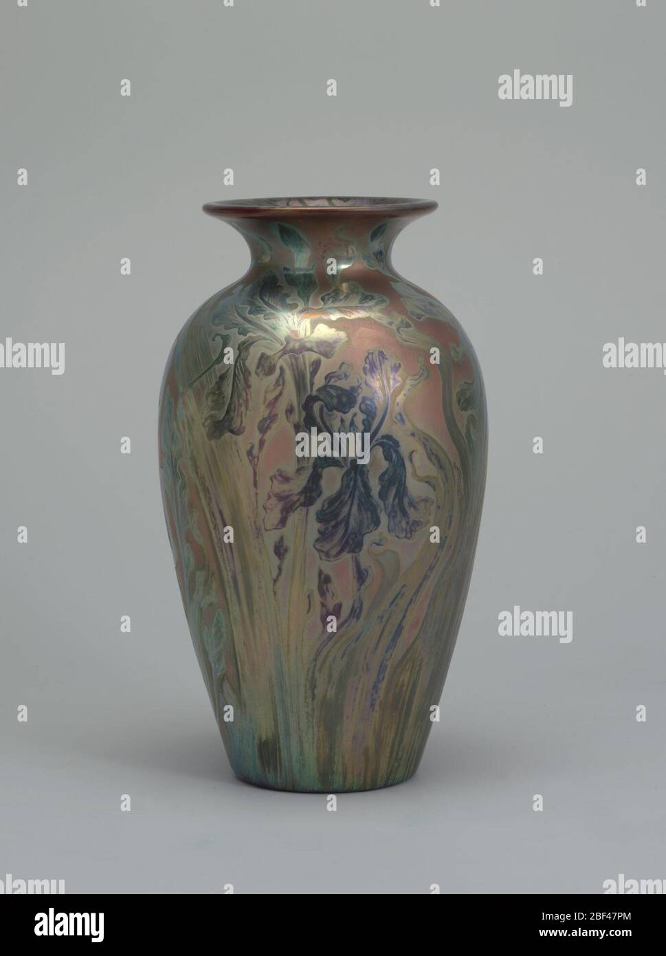 Vase. Gray-white clay body, cast. Monumental elongated ovoid body with flaring rim; no foot. Decorated with full-length irises in full bloom with slightly whiplash leaves and stems that extend up over the body and shoulder. Stock Photo